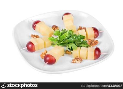 different cheese and grapes and nuts close up composition