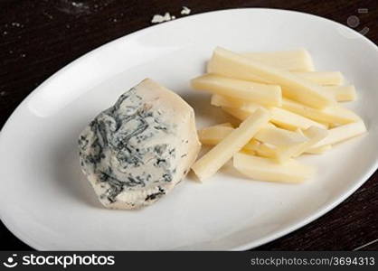 different cheese at white plate