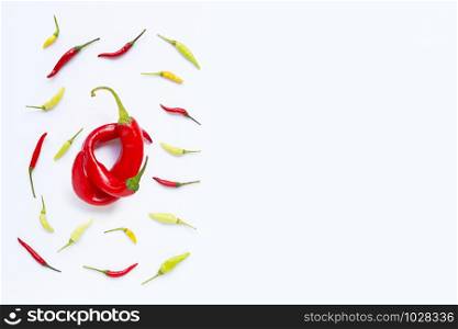 Different chili on white background. Copy space