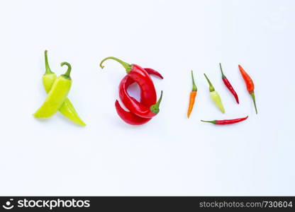 Different chili on white background. Top view