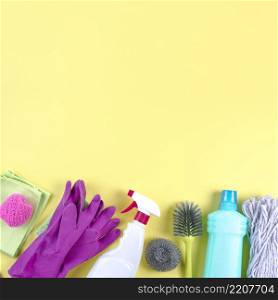 different cleaning equipments yellow backdrop