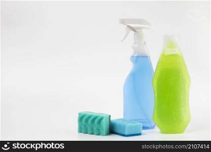 different cleaning items with white background
