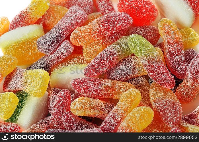 Different colorful candies jelly in sugar, background