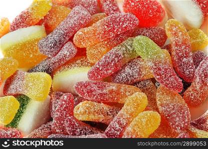 Different colorful candies jelly in sugar, background
