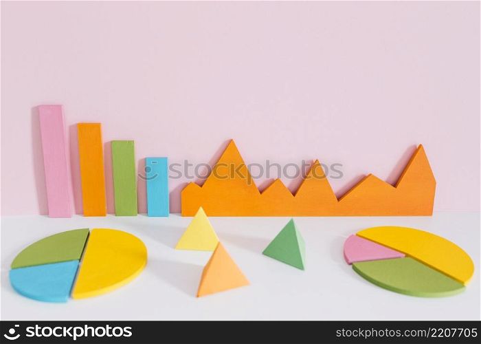 different colorful graph with pyramid shapes against pink background