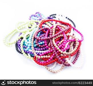Different colors of beads necklace isolated on white. Necklace palette isolated