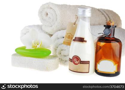 different cosmetics for body and towel on white
