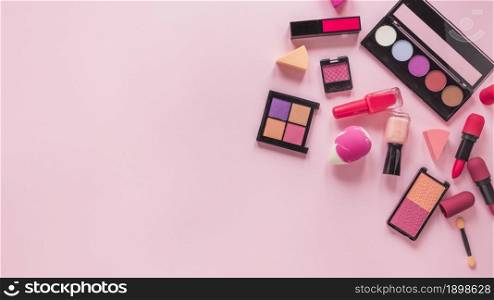 different cosmetics types scattered pink table. Resolution and high quality beautiful photo. different cosmetics types scattered pink table. High quality beautiful photo concept
