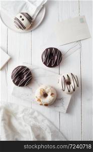 Different donuts on wooden table.