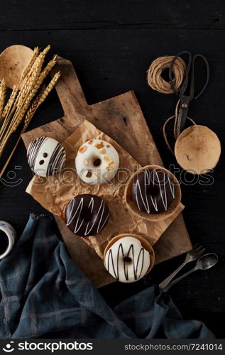 Different donuts on wooden table.