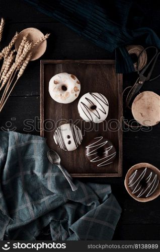 Different donuts on wooden table. 