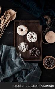 Different donuts on wooden table. 