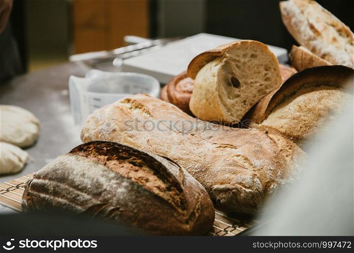 different fresh bread on the shelves in bakery. Selective focus.. different fresh bread on the shelves in bakery. Selective focus