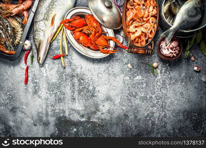 Different fresh seafood. On a rustic background.. Different fresh seafood.