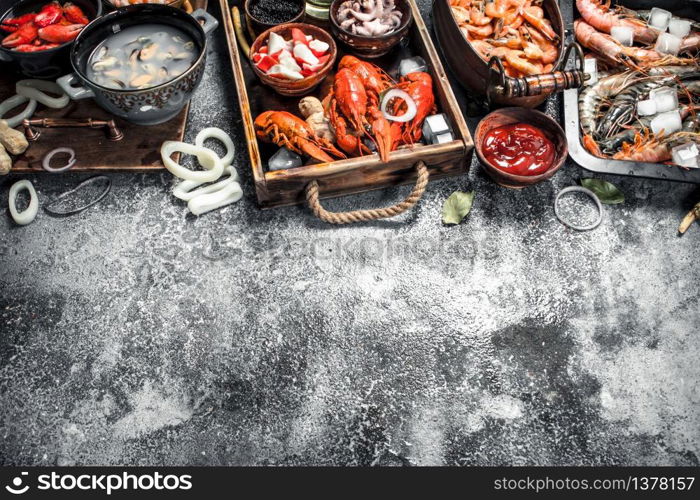 Different fresh seafood. On a rustic background.. Different fresh seafood.