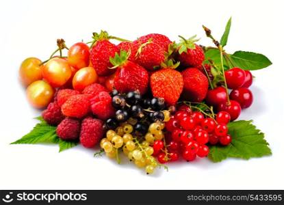 Different fruits and berries heap isolated on white background