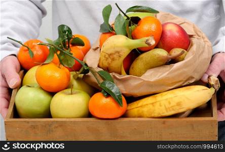 different fruits in a wooden tray