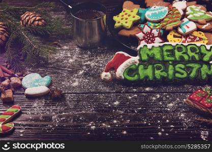 Different ginger cookies. Different ginger cookies and coffee for new years and christmas on wooden background, xmas theme. Top view.