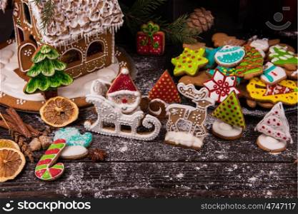 Different ginger cookies. Different ginger cookies for new years and christmas on wooden background