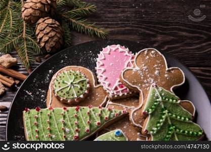 Different ginger cookies for new years and christmas on plate, closeup