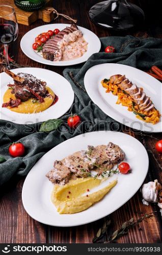different gourmet dishes for dinner with red wine