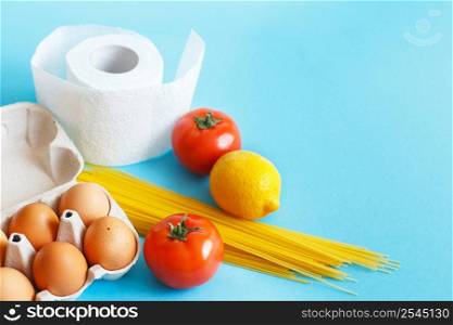 Different healthy food products on a blue background. Top view. Flat lay. Grocery online shop background. Different healthy food products on a blue background. Top view. fruit, vegetable, eggs and grocery online shop.your text