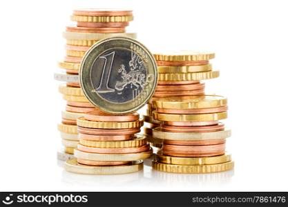 Different height stacks of Euro coins isolated on white background