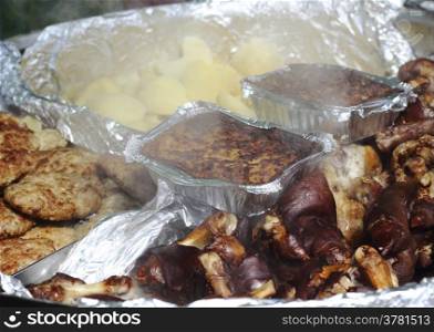 different hot meat dishes - meatloaf,cutlets,smoked pork leg