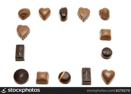 Different kind of chocolates forming a border frame