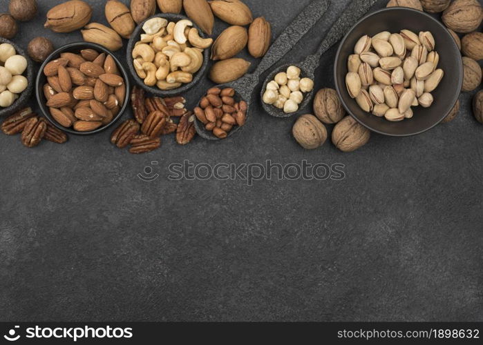 different kinds nuts dark copy space background. Resolution and high quality beautiful photo. different kinds nuts dark copy space background. High quality beautiful photo concept