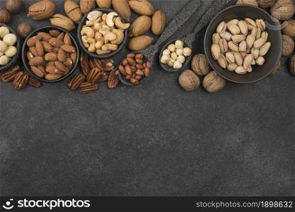 different kinds nuts dark copy space background. Resolution and high quality beautiful photo. different kinds nuts dark copy space background. High quality beautiful photo concept