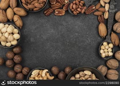 different kinds nuts frame dark copy space background