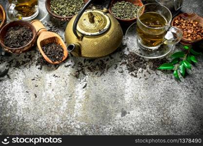 Different kinds of fragrant tea . On a rustic background.. Different kinds of fragrant tea .