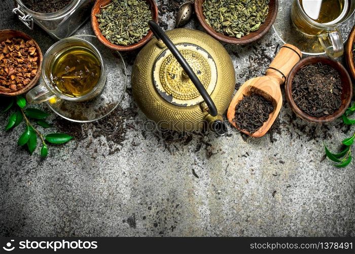Different kinds of fragrant tea . On a rustic background.. Different kinds of fragrant tea .