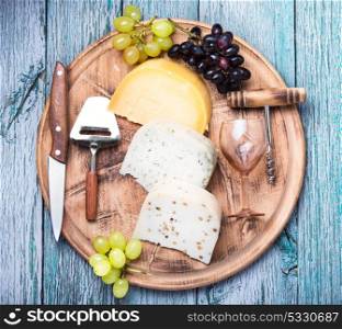 Different kinds of swiss cheeses. aromatic Swiss cheese and glass of grape wine