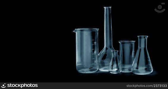 different laboratory glassware for analysis on black background with clipping path