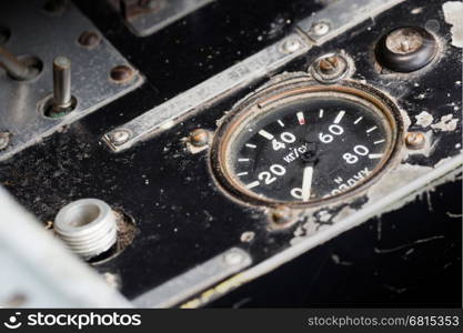 Different meters and displays in the console of an old plane