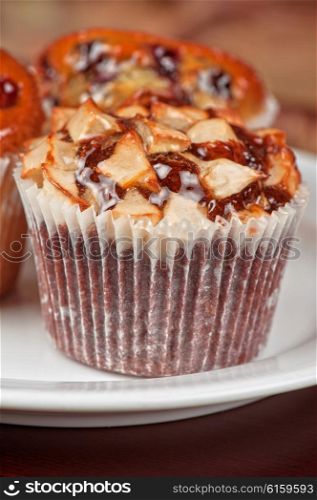 different muffins with apples . different muffins with fresh apples on white