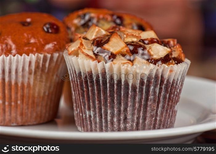 different muffins with fresh apples on white. muffins