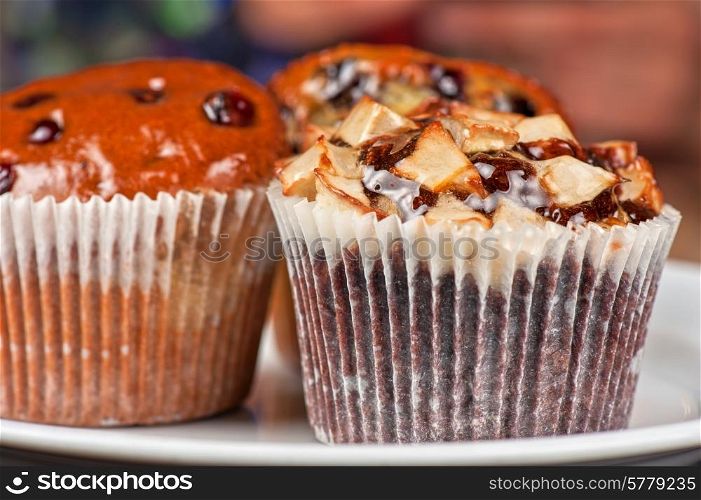different muffins with fresh apples on white. muffins