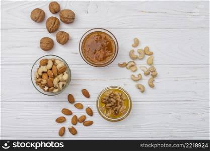different nuts with honey white table