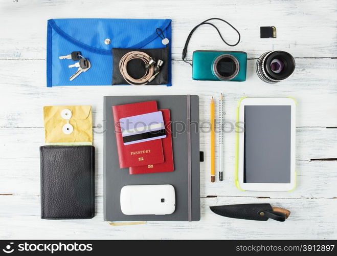 Different objects for traveling on wooden background