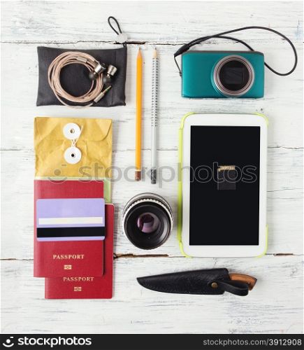 Different objects for traveling on wooden background
