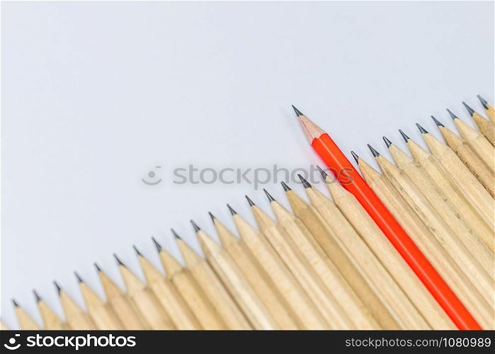 Different pencil standout from the others showing concept of unique business thinking different from the crowd and special one with leadership skill.
