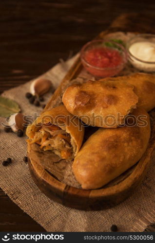 Different pies composition. Different pies from meat and vegetables. Freshly baked cakes on a table