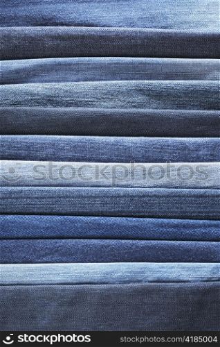 Different shades of blue jeans denim fabrics.