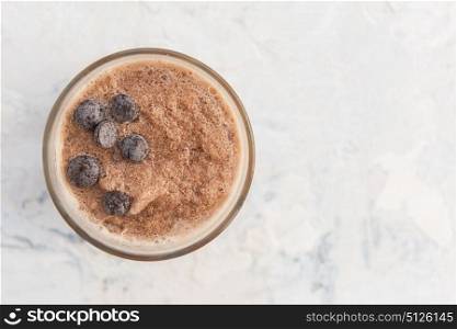 Different smoothie set. Chocolate smoothie on a white concrete background
