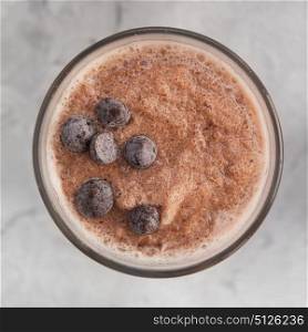 Different smoothie set. Chocolate smoothie on a white concrete background. Square cropping