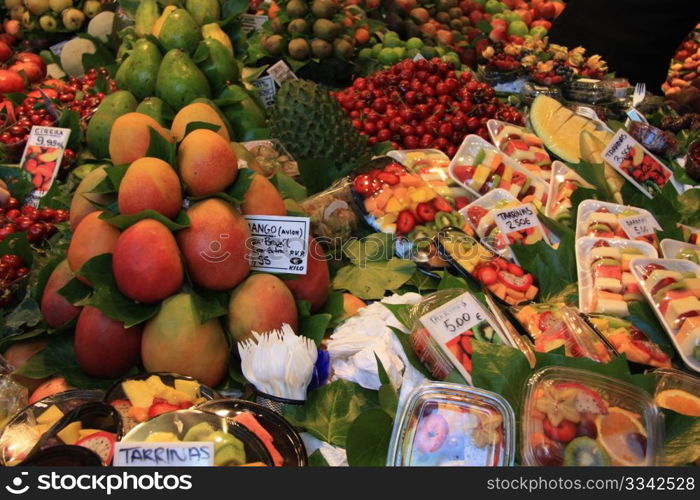Different sorts of fruits, displayed on a Spanish market