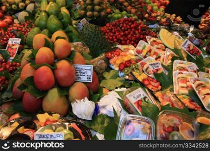 Different sorts of fruits, displayed on a Spanish market